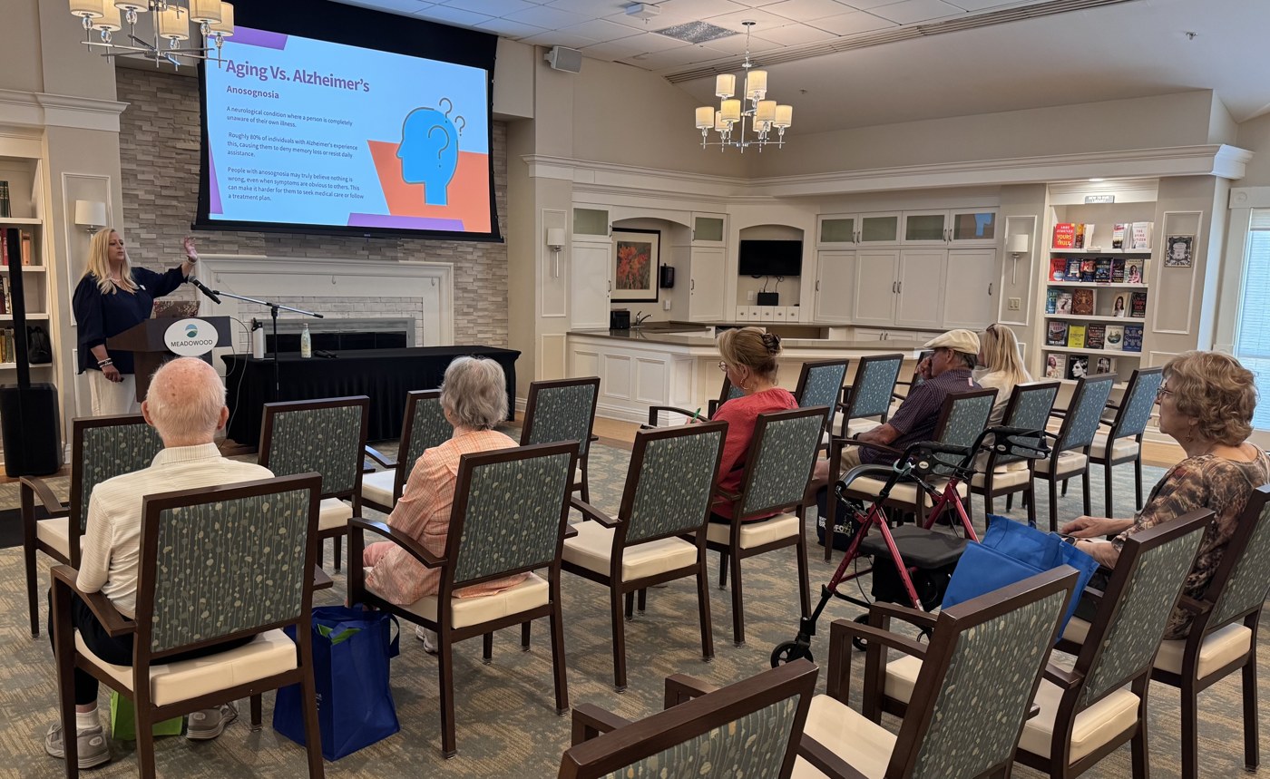 Attendees listening to a speaker at a local dementia education presentation